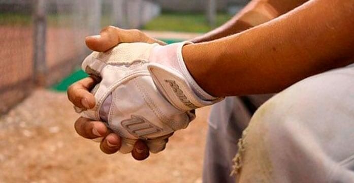Baseball player sittnig on the bench Baseball all-star shift puts spotlight on Colorado’s exceptional voting laws